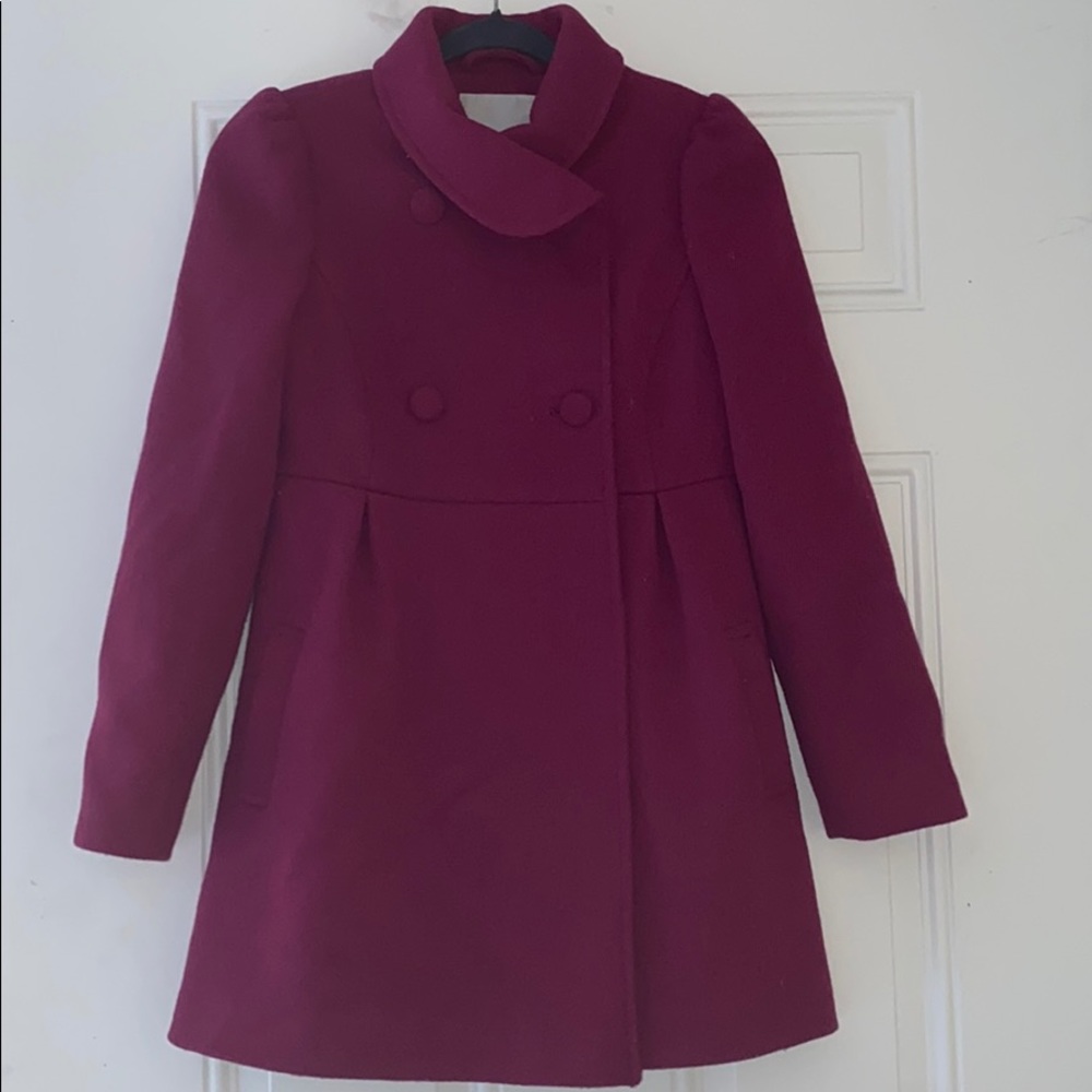 Pink Coat notched collar and pretty skirted hem.